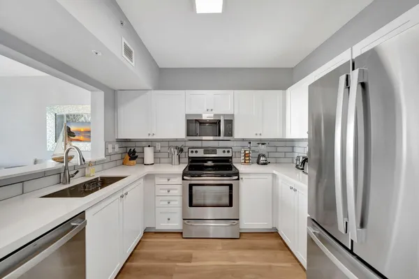 a kitchen with a sink and a window