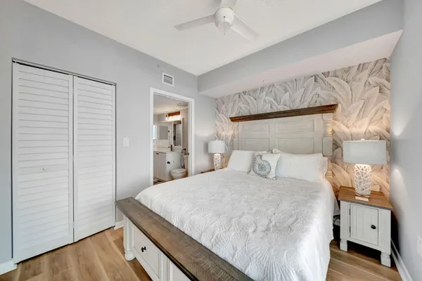 a bedroom with a bed and a couch