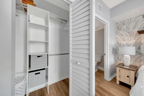 a living room with furniture a rug and a window