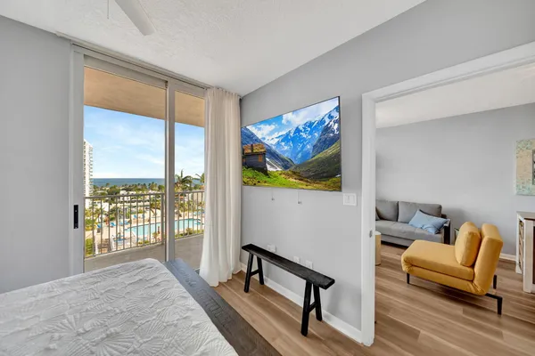 a view of hallway with wooden floor