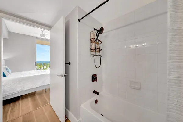 a spacious bathroom with a toilet sink and a mirror