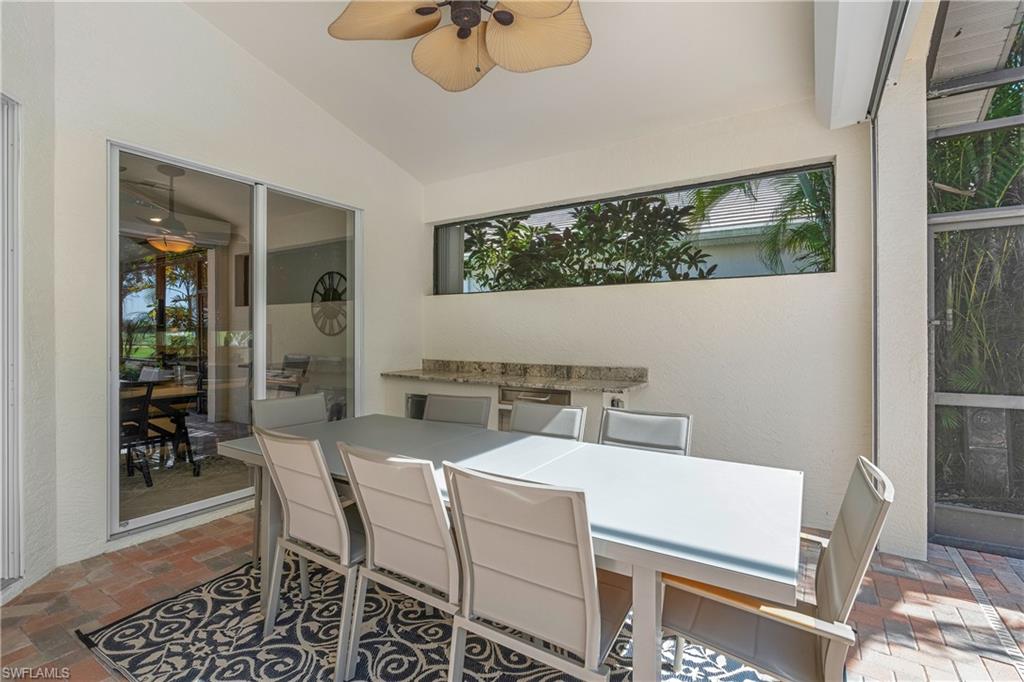 4923 Cerromar Drive Naples, FL 34112 - Photo 12 of 39 a view of a dining room with furniture window and outside view