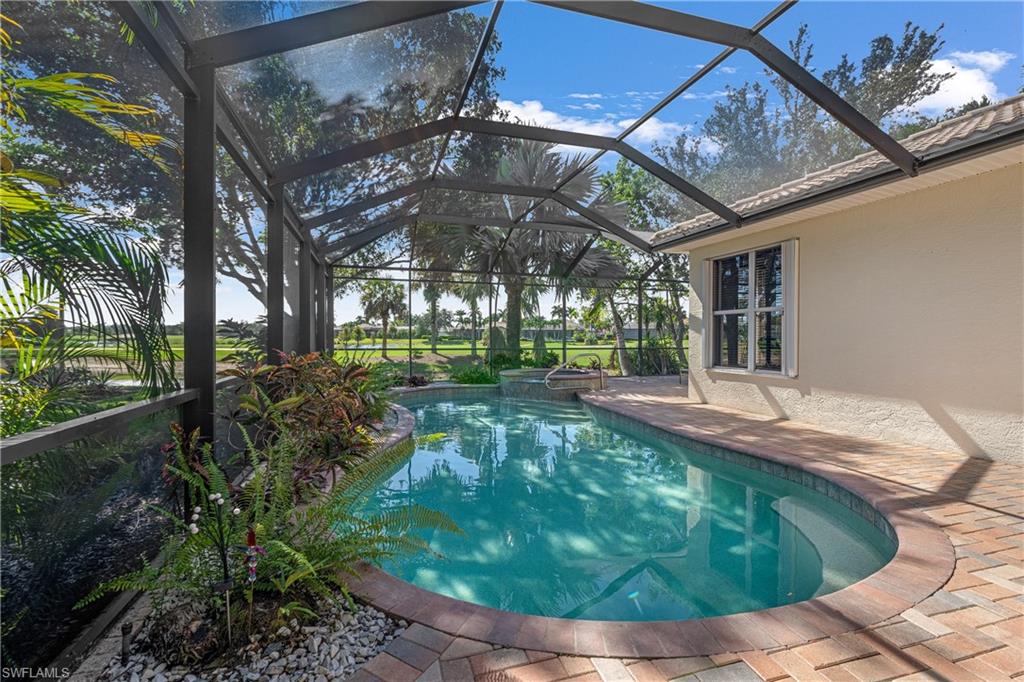 4923 Cerromar Drive Naples, FL 34112 - Photo 14 of 39 a view of a house with a yard