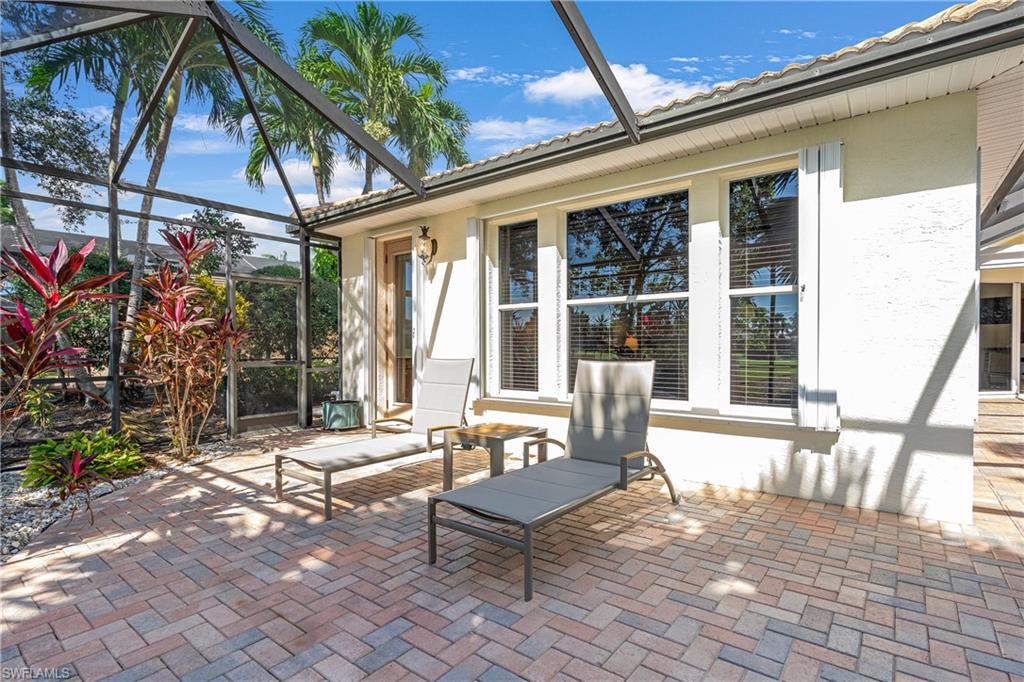 4923 Cerromar Drive Naples, FL 34112 - Photo 16 of 39 a front view of a house with outdoor seating
