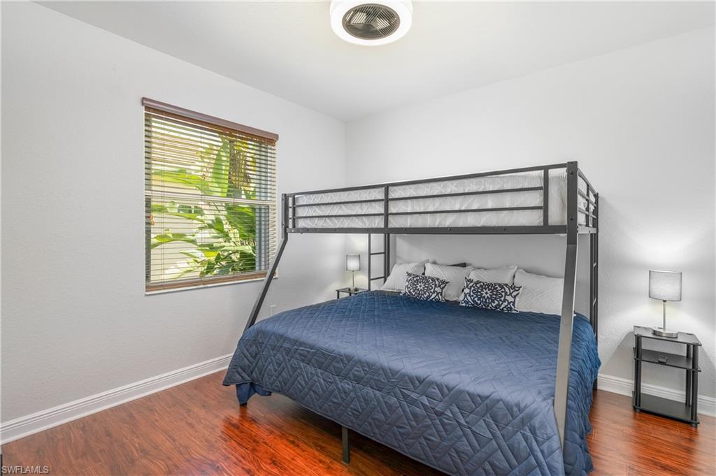 4923 Cerromar Drive Naples, FL 34112 - Photo 23 of 39 a bedroom with bed and window