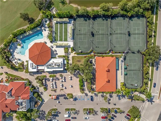 an aerial view of a house with a swimming pool and outdoor space