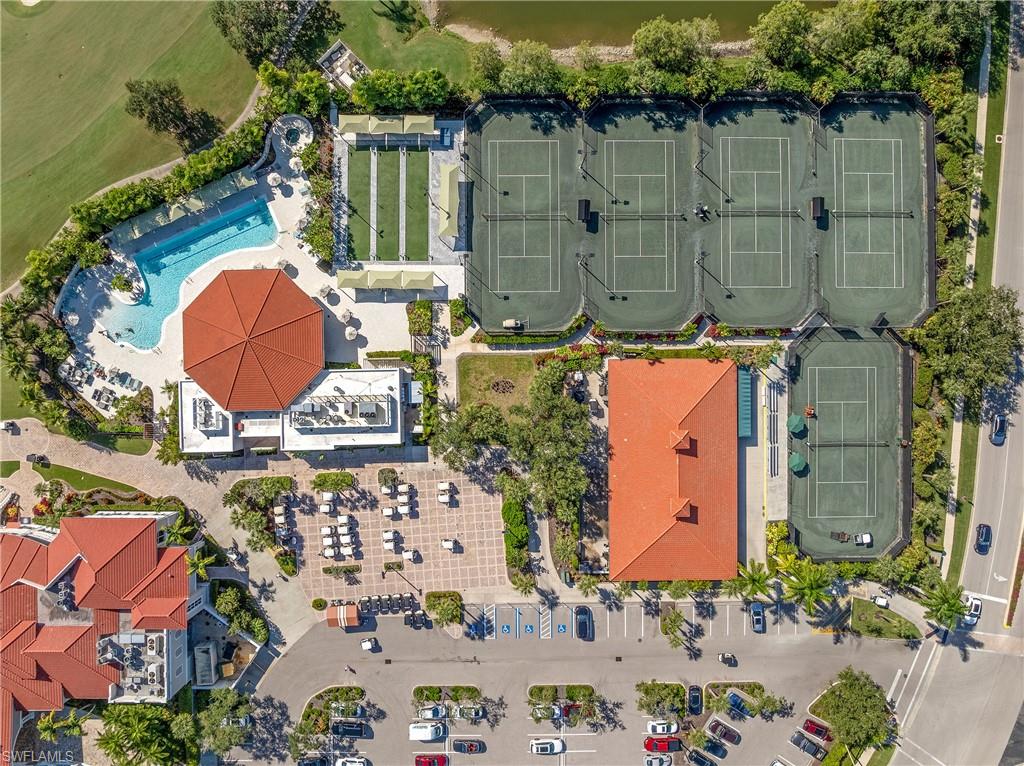 4923 Cerromar Drive Naples, FL 34112 - Photo 30 of 39 an aerial view of a house with a swimming pool and outdoor space