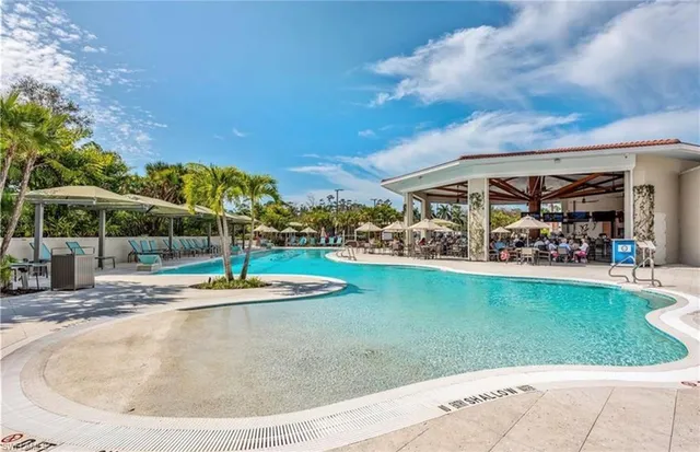 a view of a swimming pool with a patio