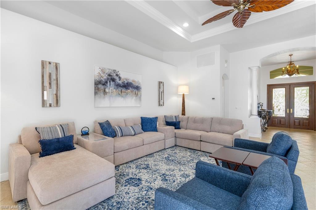 4923 Cerromar Drive Naples, FL 34112 - Photo 7 of 39 a living room with furniture and a large window