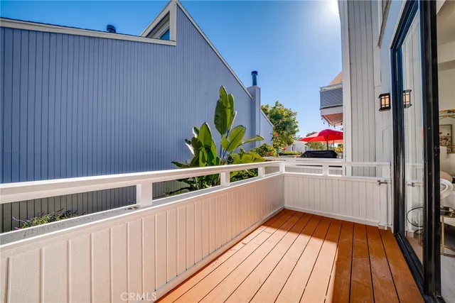 a view of balcony with wooden floor