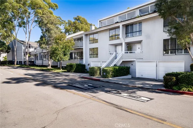a front view of a house with a yard and a garage