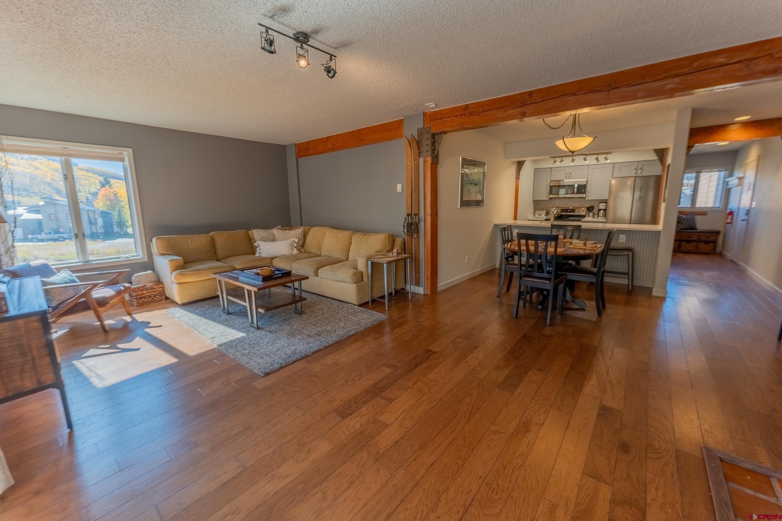 25 Emmons Road, Unit 37 Crested Butte, CO 81225 - Photo 11 of 35 a living room with furniture and a wooden floor