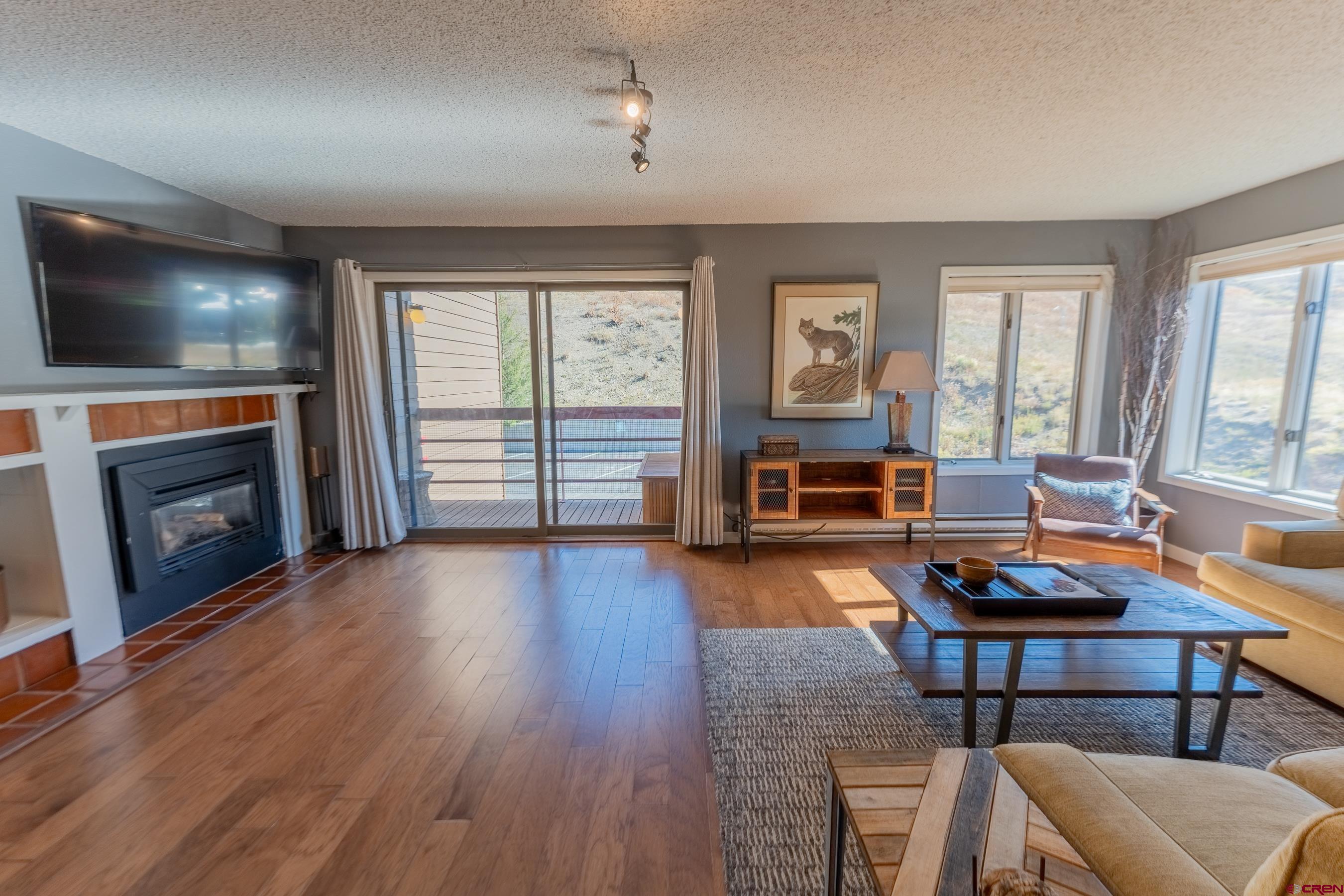 25 Emmons Road, Unit 37 Crested Butte, CO 81225 - Photo 14 of 35 a living room with furniture and a fireplace