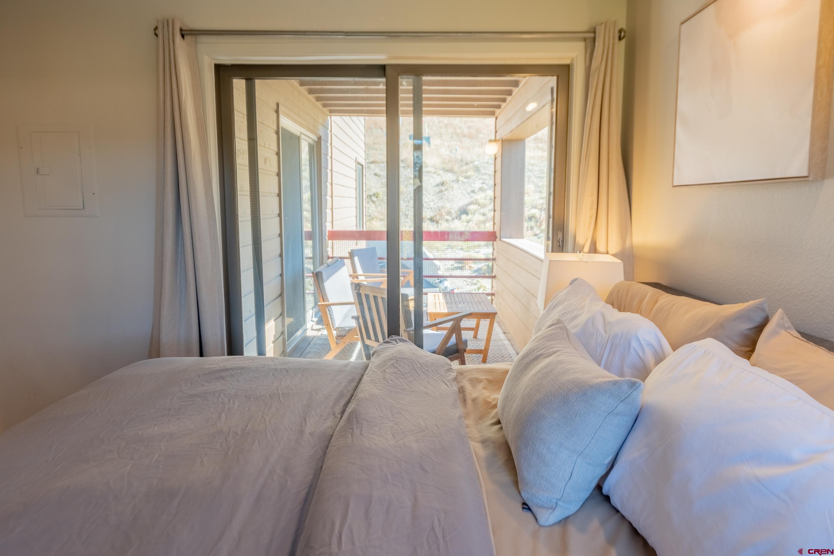 25 Emmons Road, Unit 37 Crested Butte, CO 81225 - Photo 19 of 35 a bedroom with furniture and a window