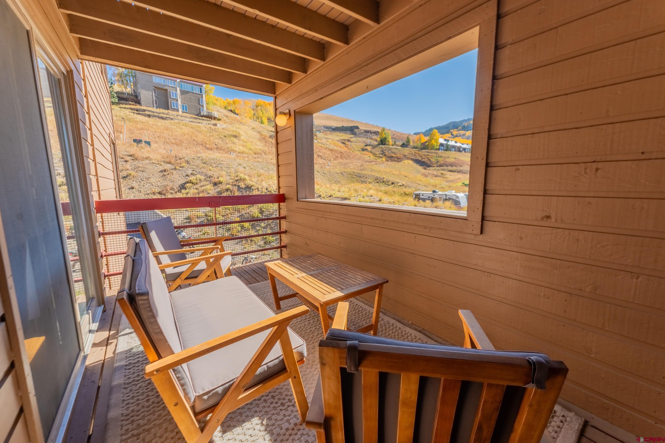 25 Emmons Road, Unit 37 Crested Butte, CO 81225 - Photo 21 of 35 a view of a balcony with furniture and a window