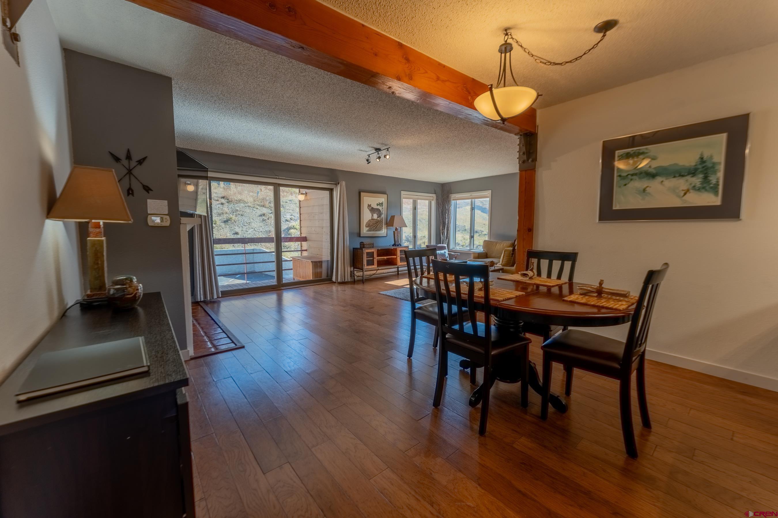 25 Emmons Road, Unit 37 Crested Butte, CO 81225 - Photo 8 of 35 a view of a dining room with furniture and wooden floor