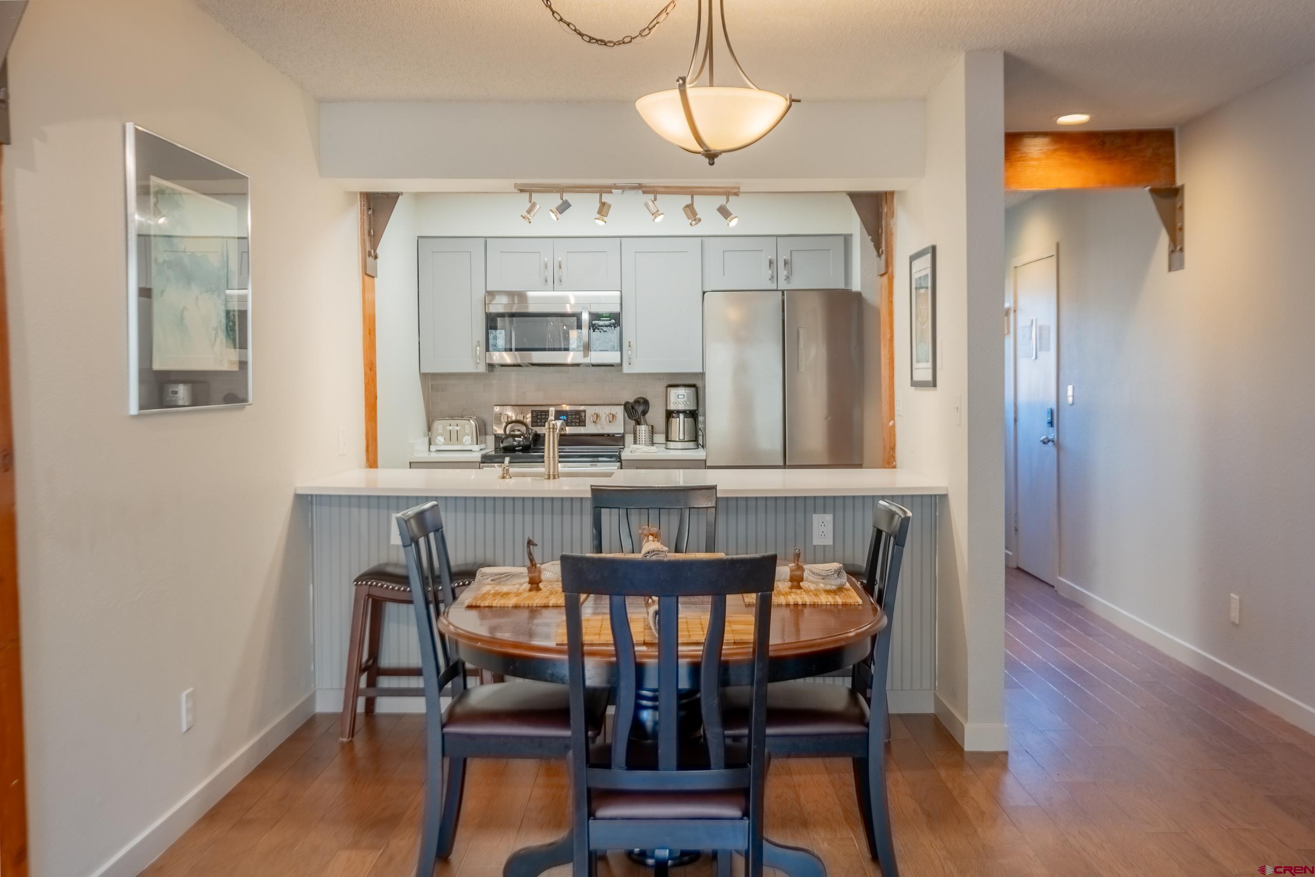 25 Emmons Road, Unit 37 Crested Butte, CO 81225 - Photo 9 of 35 a view of a dining room with furniture window and wooden floor