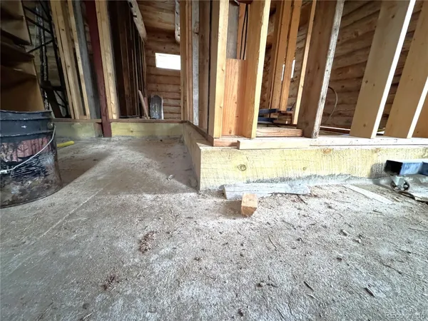 a view of water heater room with window