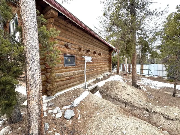 a view of a house with a snow in the yard
