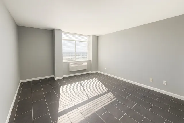 a view of an empty room and a window