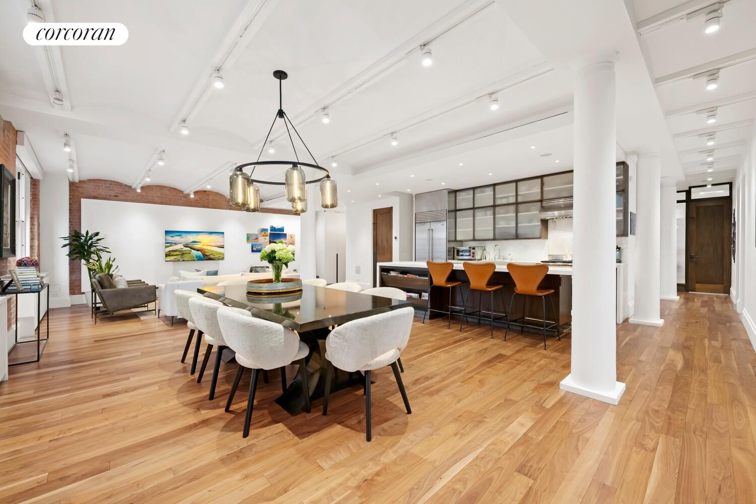 55 Hudson Street, Unit 7CD Manhattan, NY 10013 - Photo 12 of 25 a view of a dining room with furniture window and wooden floor