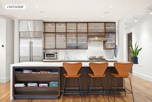 a kitchen with stainless steel appliances granite countertop a stove and cabinets