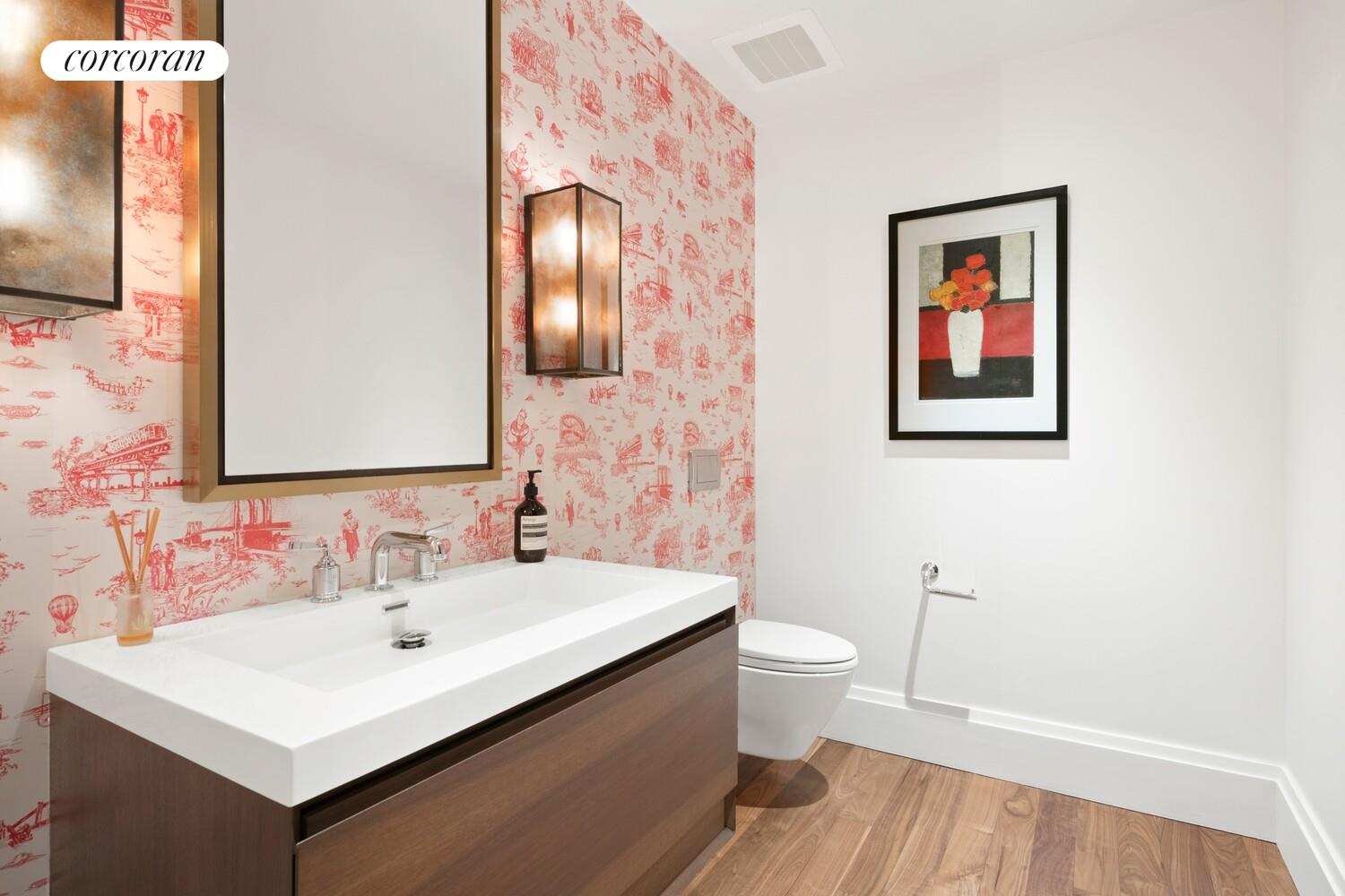 55 Hudson Street, Unit 7CD Manhattan, NY 10013 - Photo 23 of 25 a bathroom with a sink mirror and a toilet