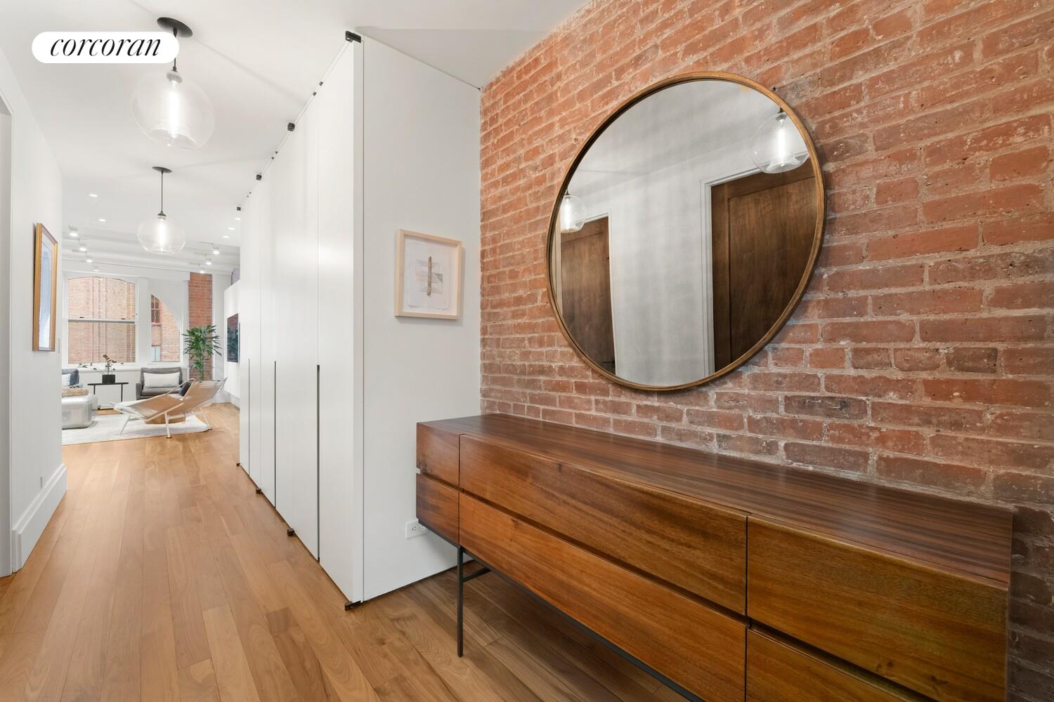 55 Hudson Street, Unit 7CD Manhattan, NY 10013 - Photo 24 of 25 a view of a living room and bathroom with a wooden floor