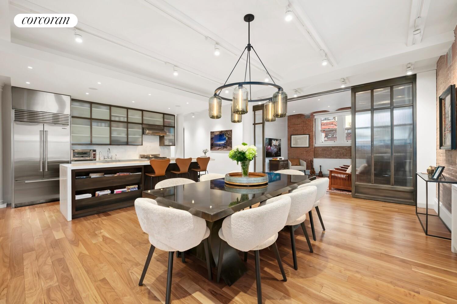55 Hudson Street, Unit 7CD Manhattan, NY 10013 - Photo 7 of 25 a living room with furniture a window and stainless steel appliances