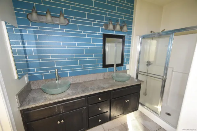 a view of a storage and utility room with a washer dryer