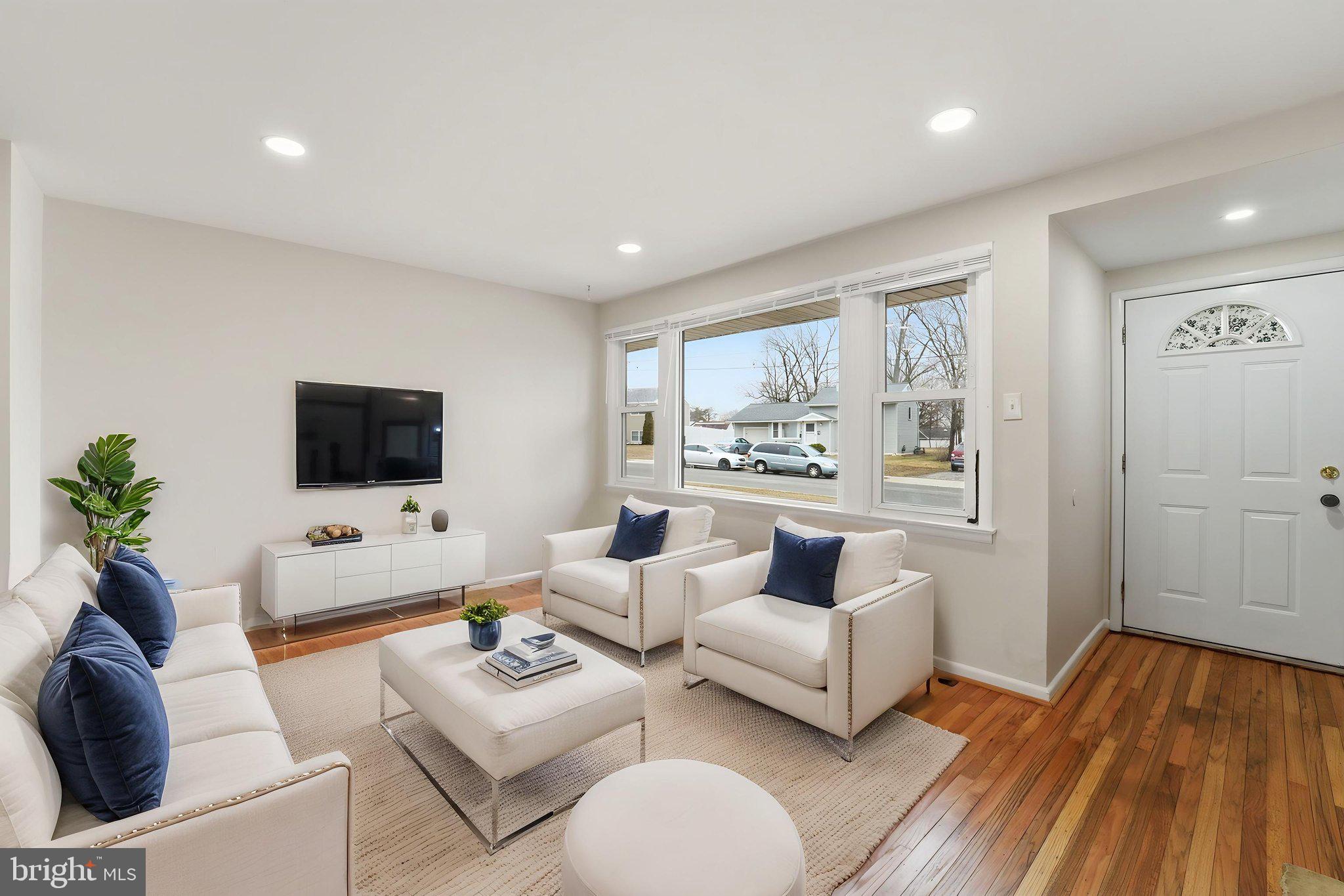 490 Hamilton Road Wenonah, NJ 08090 - Photo 11 of 49 a living room with furniture and a flat screen tv