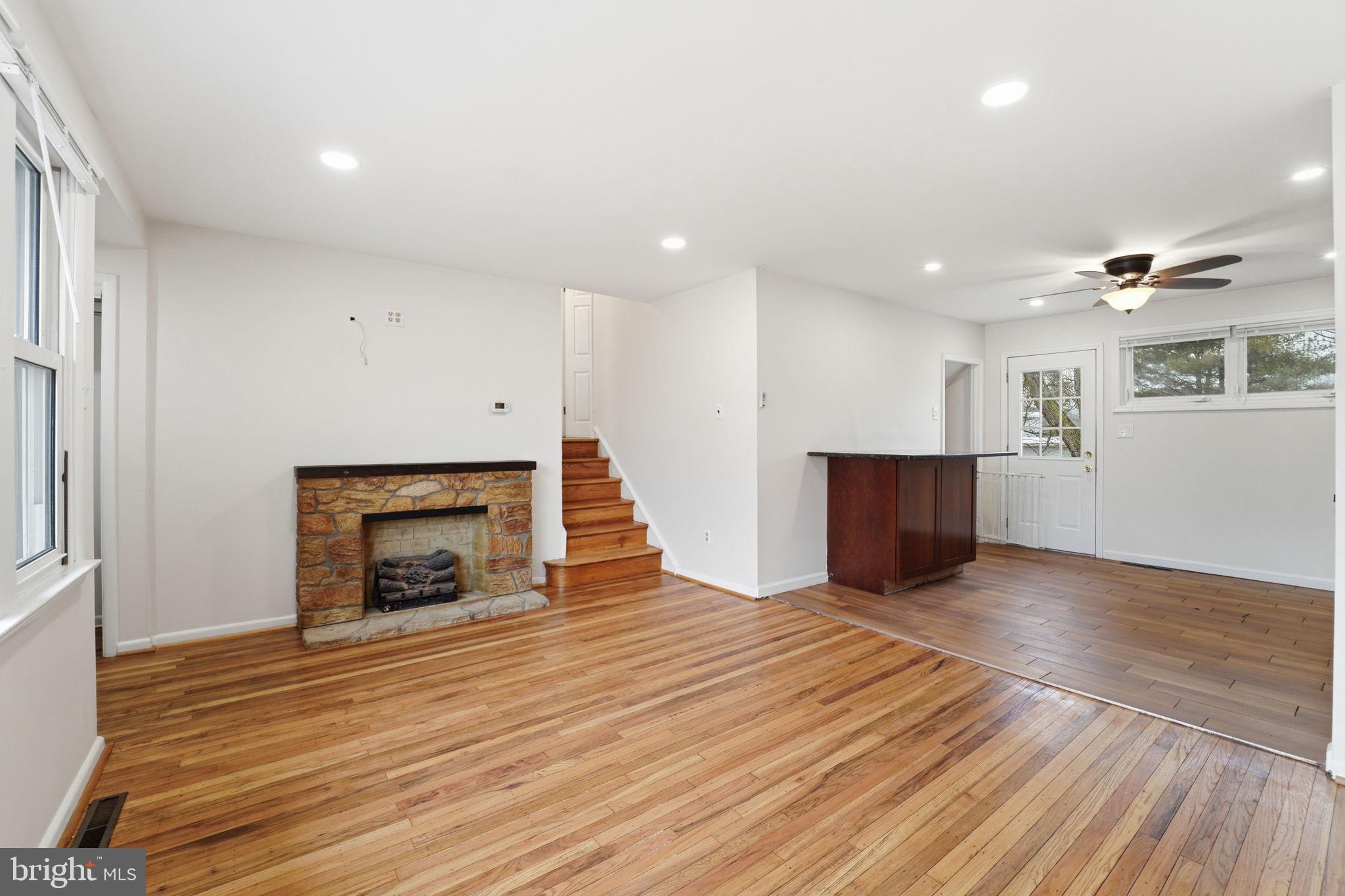 490 Hamilton Road Wenonah, NJ 08090 - Photo 12 of 49 a view of empty room with wooden floor and fireplace