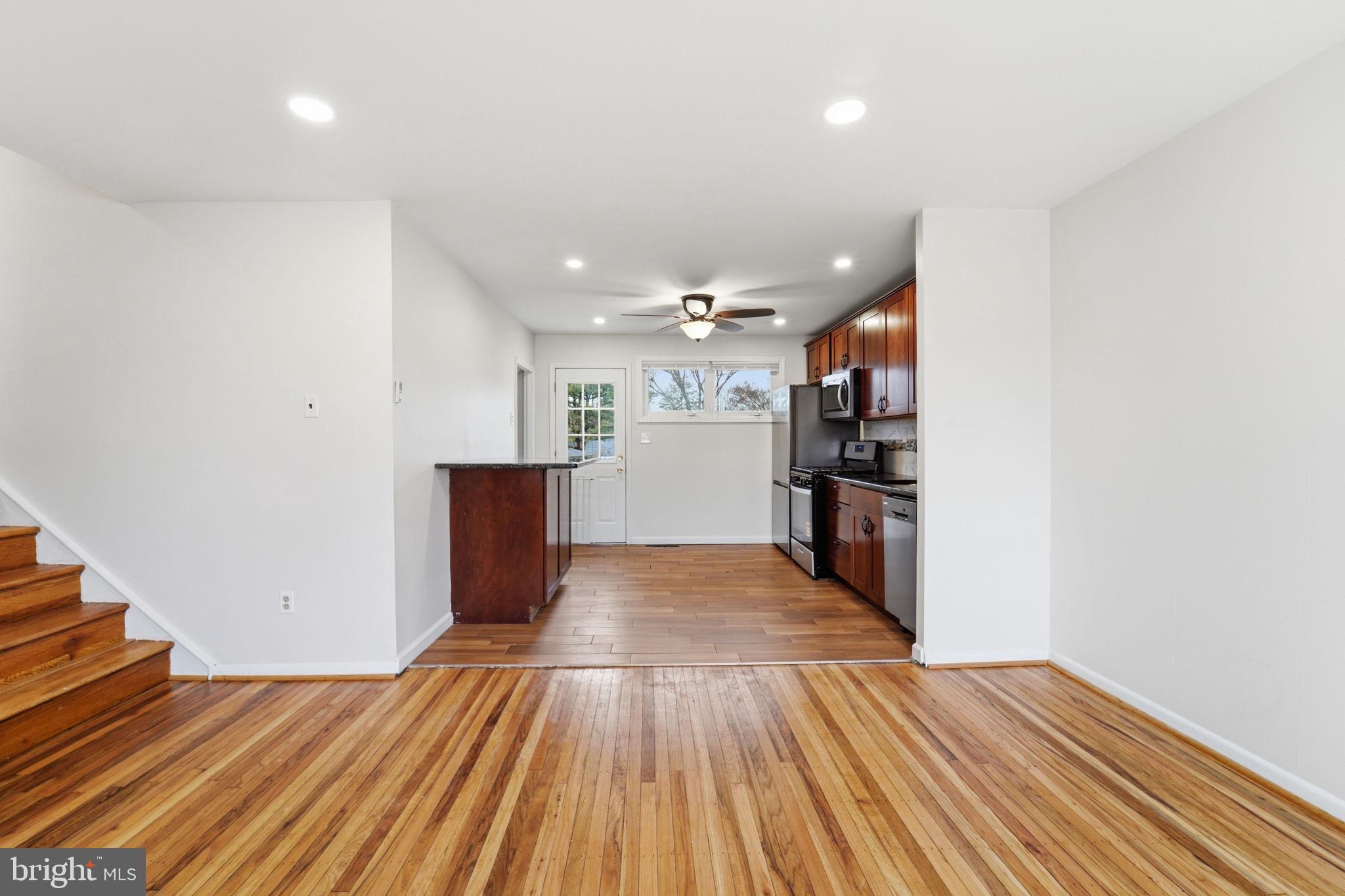 490 Hamilton Road Wenonah, NJ 08090 - Photo 16 of 49 a view of a room with wooden floor and stairs
