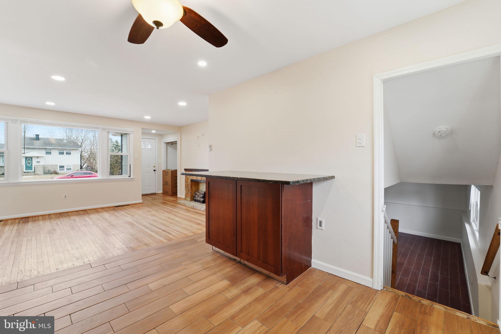 490 Hamilton Road Wenonah, NJ 08090 - Photo 21 of 49 a view of an empty room with wooden floor and a window