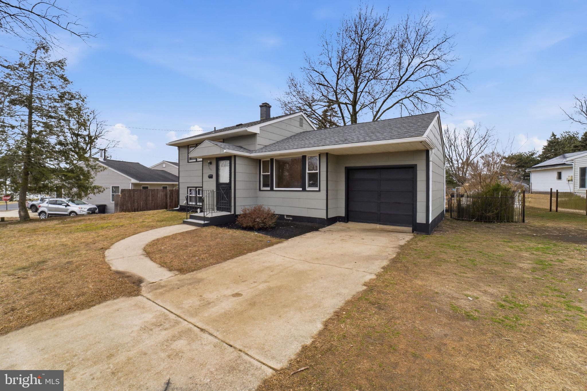490 Hamilton Road Wenonah, NJ 08090 - Photo 3 of 49 a front view of a house with a yard and garage