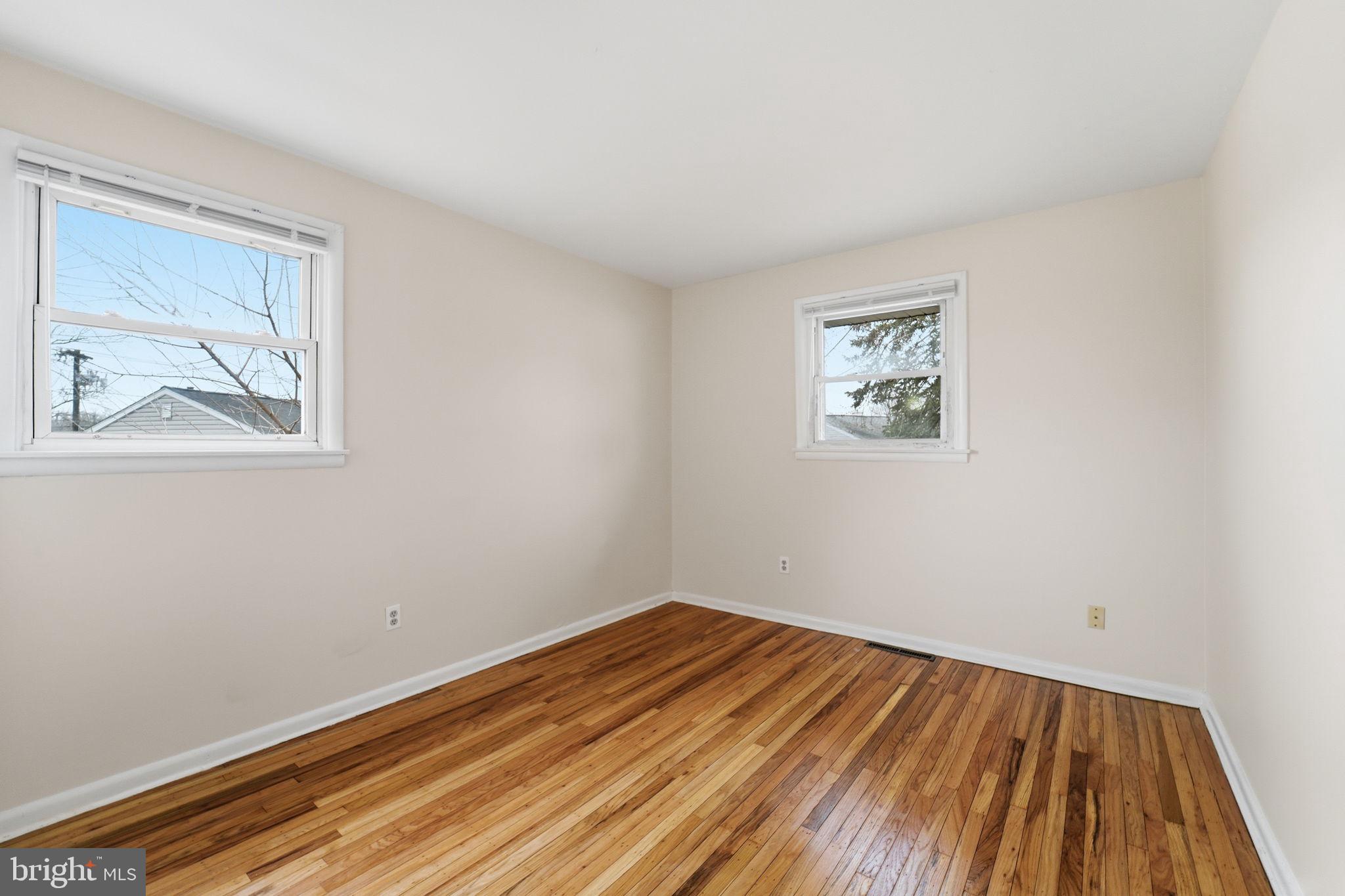 490 Hamilton Road Wenonah, NJ 08090 - Photo 35 of 49 a view of a room with wooden floor and a window