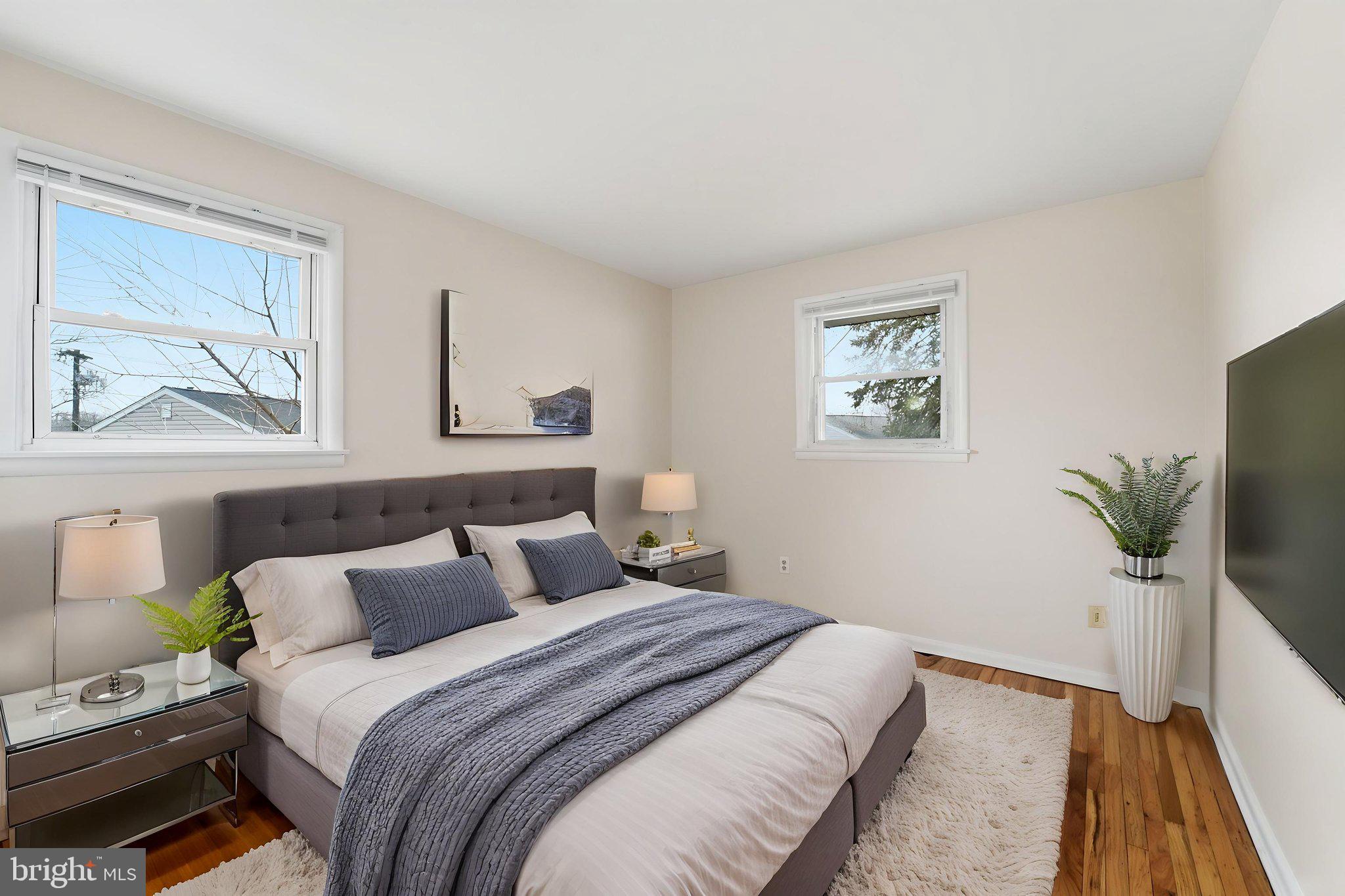 490 Hamilton Road Wenonah, NJ 08090 - Photo 36 of 49 a bedroom with a bed and a flat screen tv