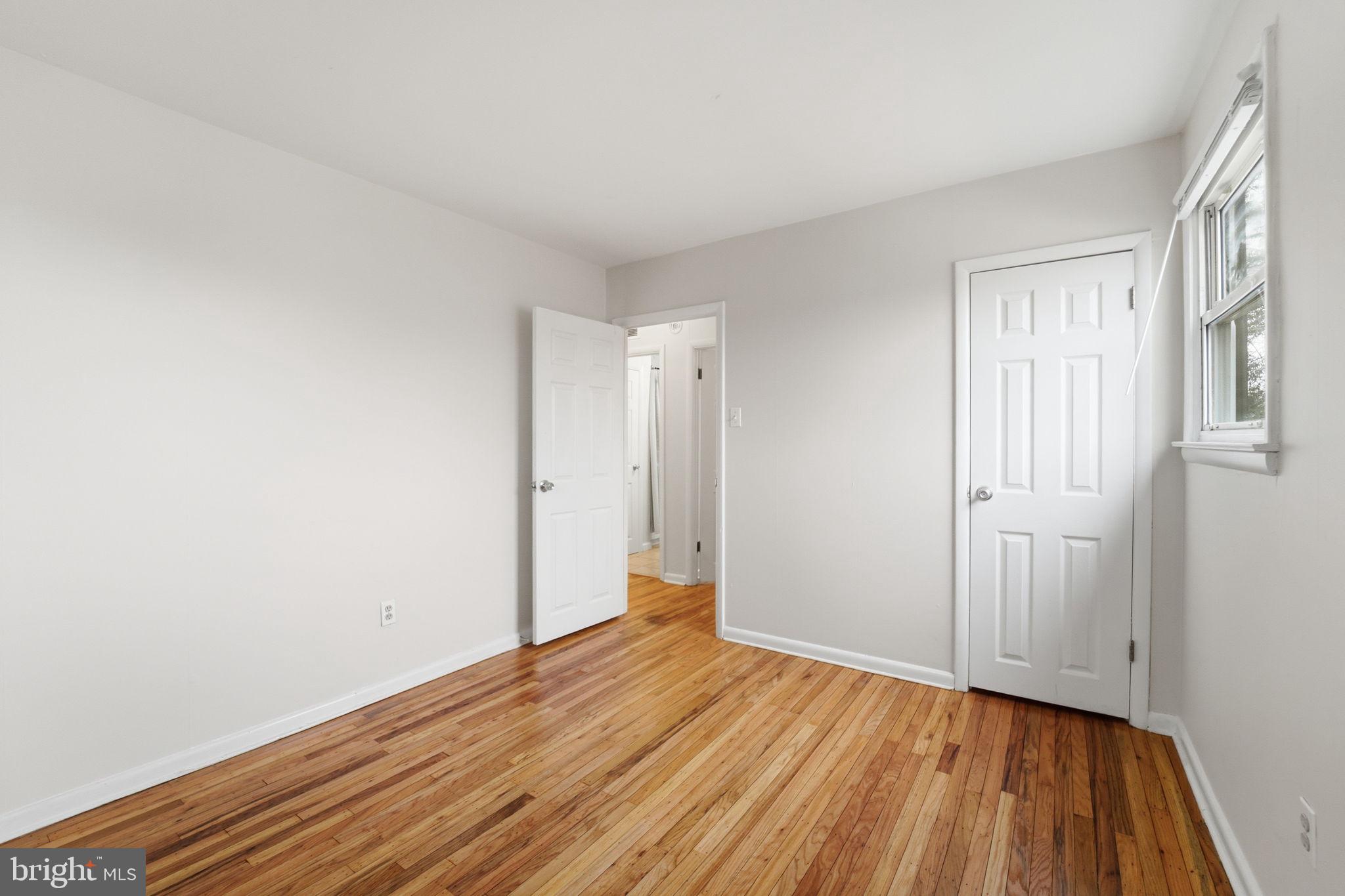 490 Hamilton Road Wenonah, NJ 08090 - Photo 40 of 49 a view of a room with wooden floor and brick walls