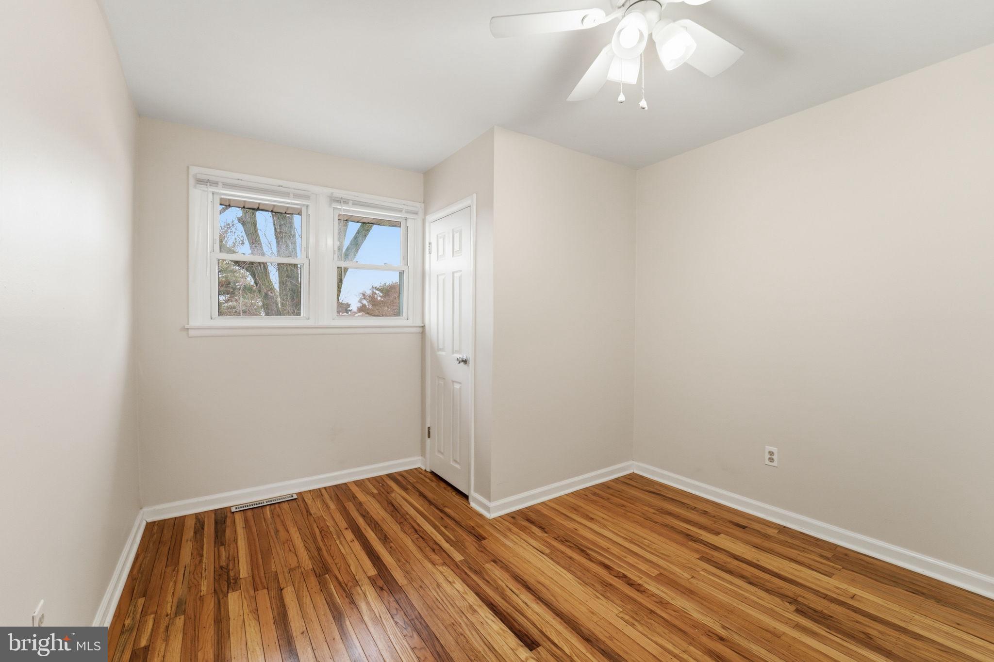 490 Hamilton Road Wenonah, NJ 08090 - Photo 43 of 49 wooden floor in an empty room with a window
