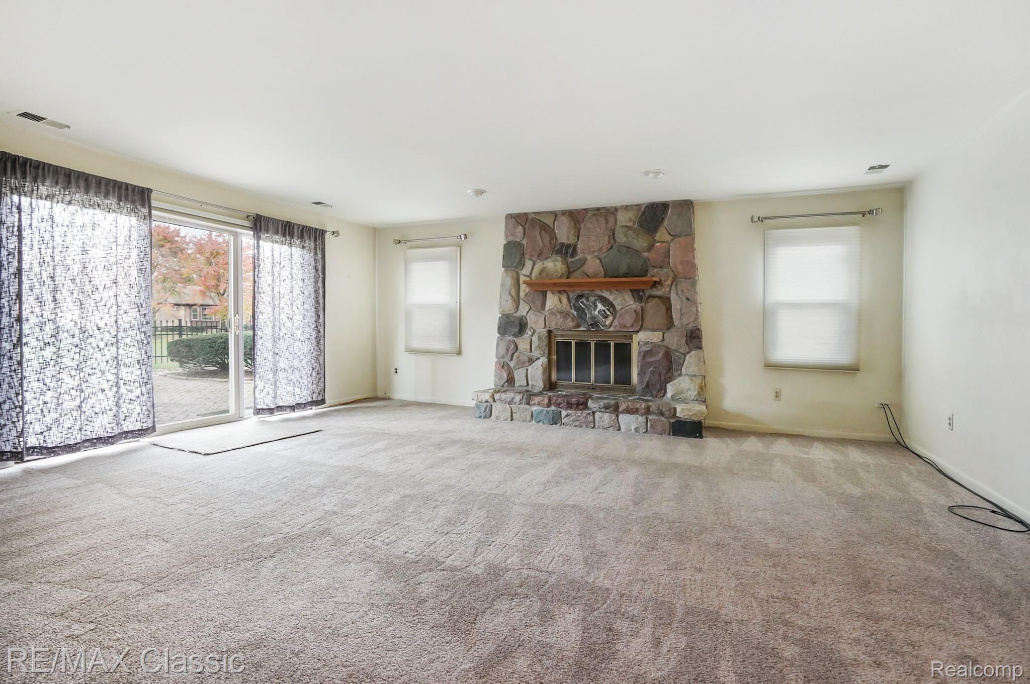35152 Banbury Road Livonia, MI 48152 - Photo 20 of 33 Warm natural fireplace with Stone surround