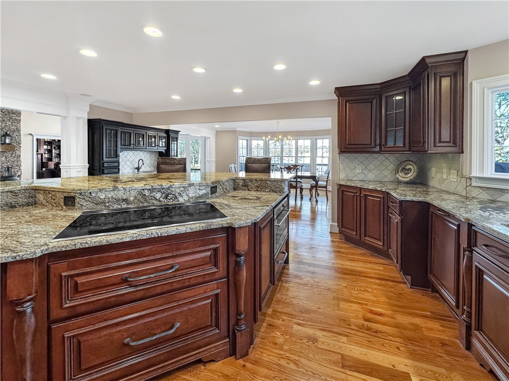 26 Beacon Ridge Circle Salem, SC 29676 - Photo 18 of 46 This spacious kitchen features ample counter space, rich cabinetry, and a vibrant hardwood floor.