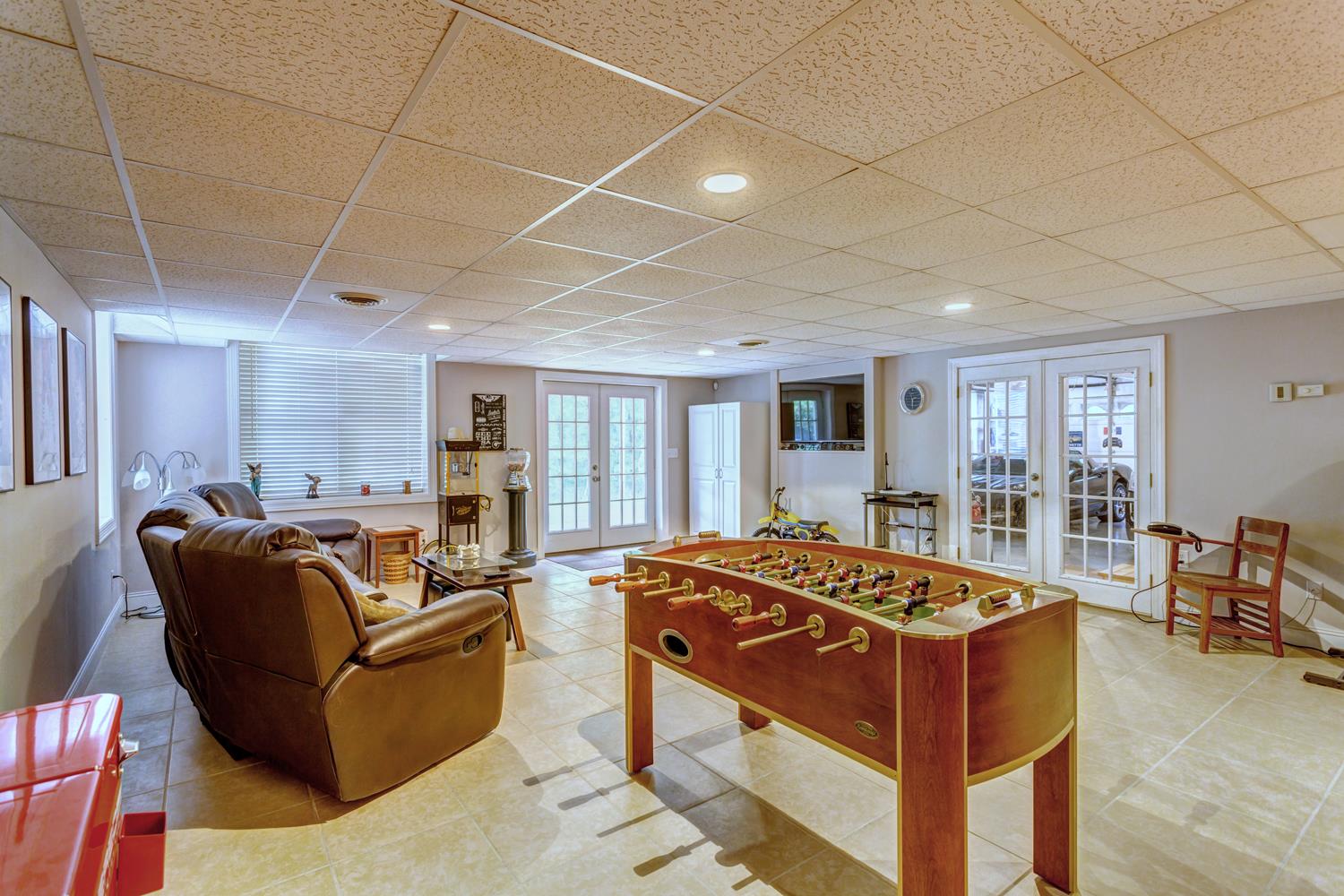 7571 Webster Road White House, TN 37188 - Photo 20 of 30 a living room with furniture a dining table and chairs with wooden floor