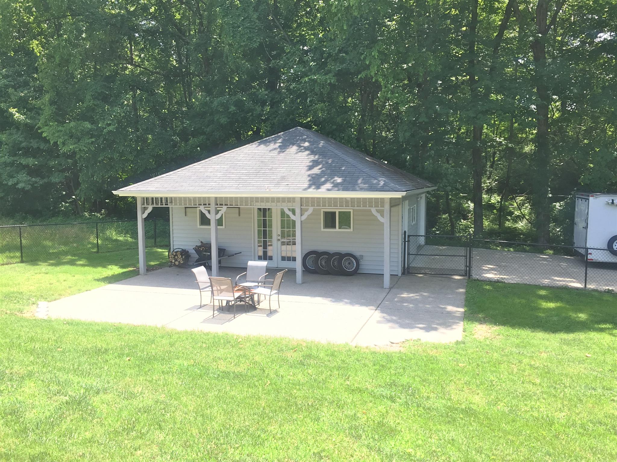 7571 Webster Road White House, TN 37188 - Photo 25 of 30 a patio with table and chairs and potted plants