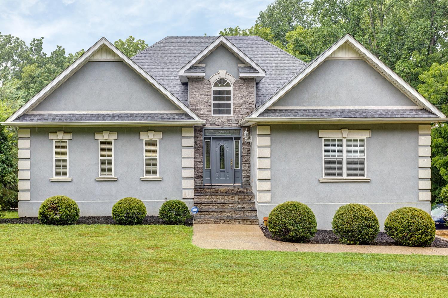 7571 Webster Road White House, TN 37188 - Photo 3 of 30 a front view of a house with a yard and garage