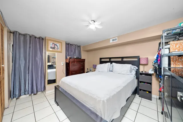 a bedroom with a bed and a closet