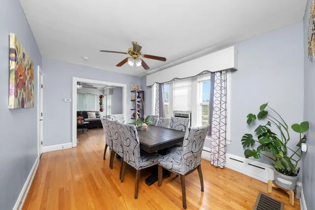 a dining room with furniture and window