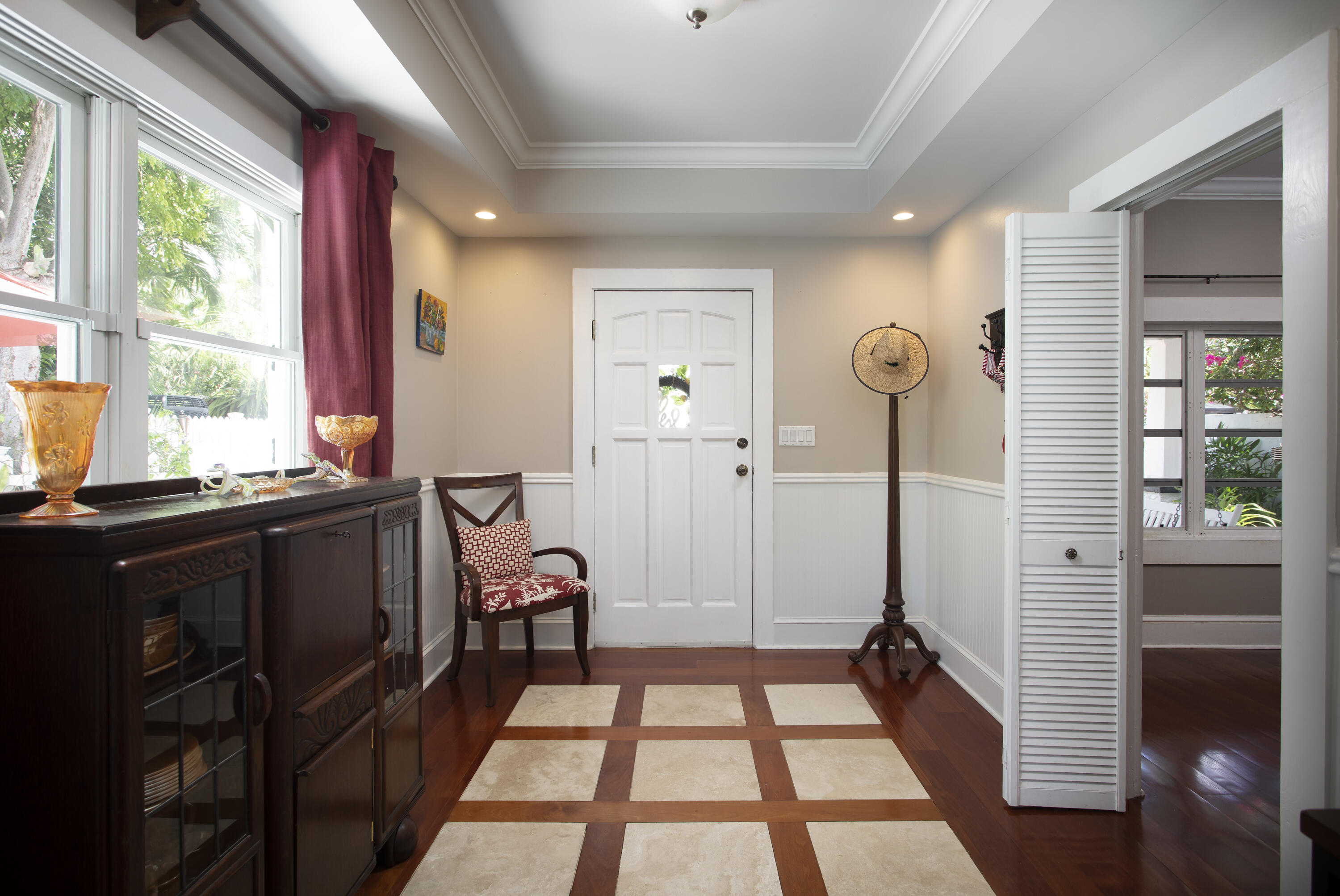 1506 South Street Key West, FL 33040 - Photo 11 of 27 a view of a hallway with furniture and windows