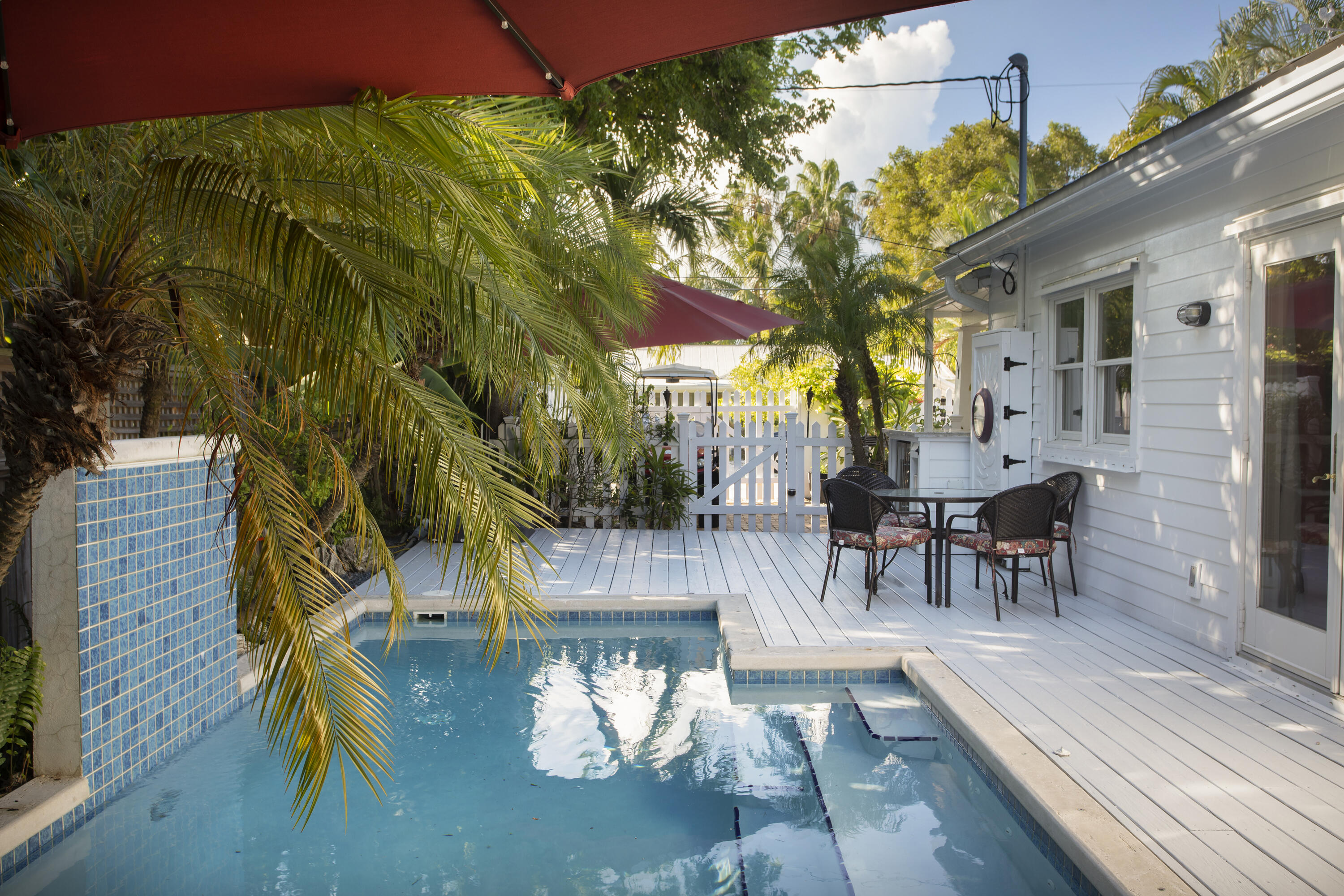 1506 South Street Key West, FL 33040 - Photo 16 of 27 a view of a patio with table and chairs and potted plants