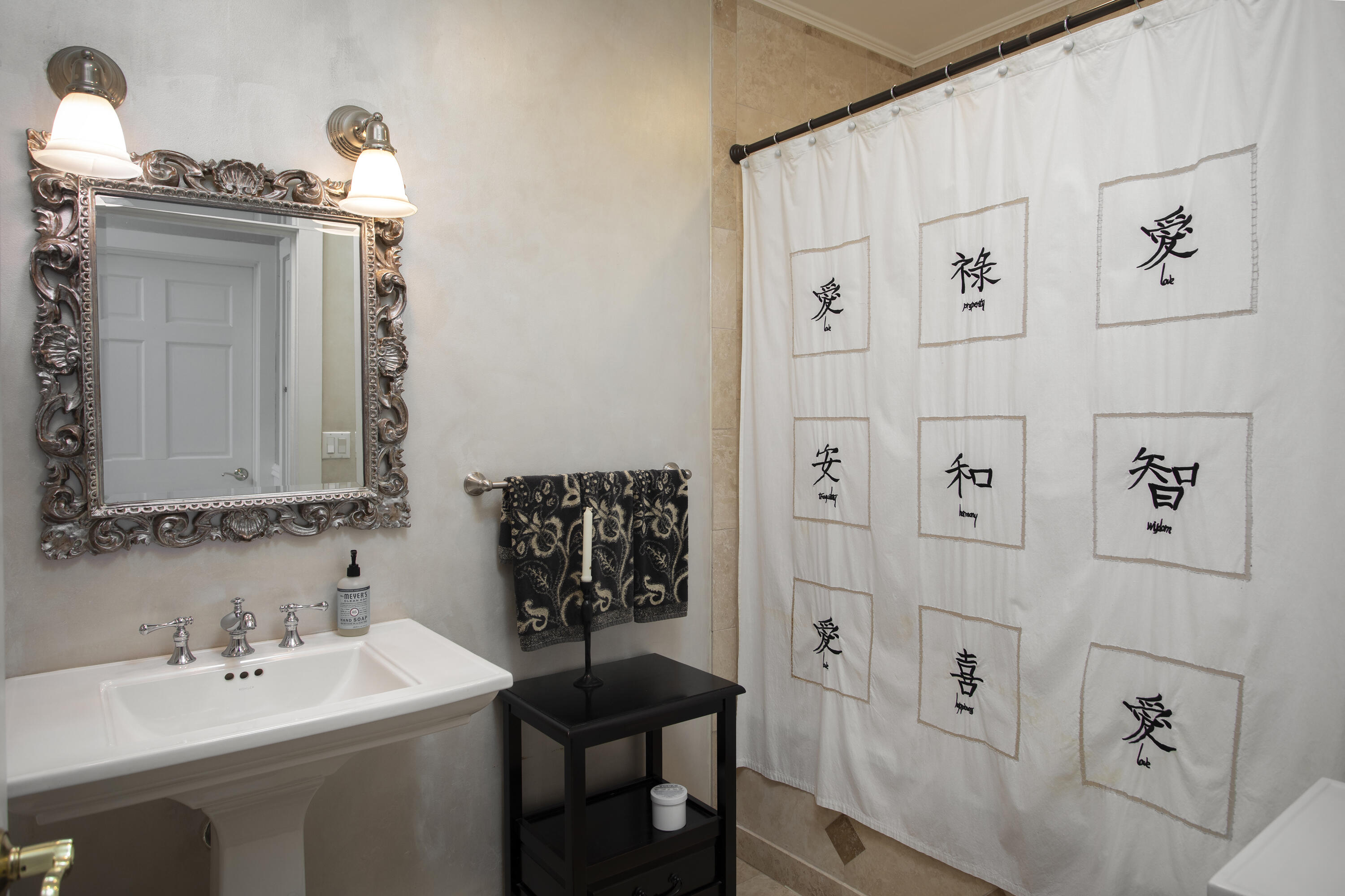1506 South Street Key West, FL 33040 - Photo 22 of 27 a bathroom with a sink a toilet and mirror