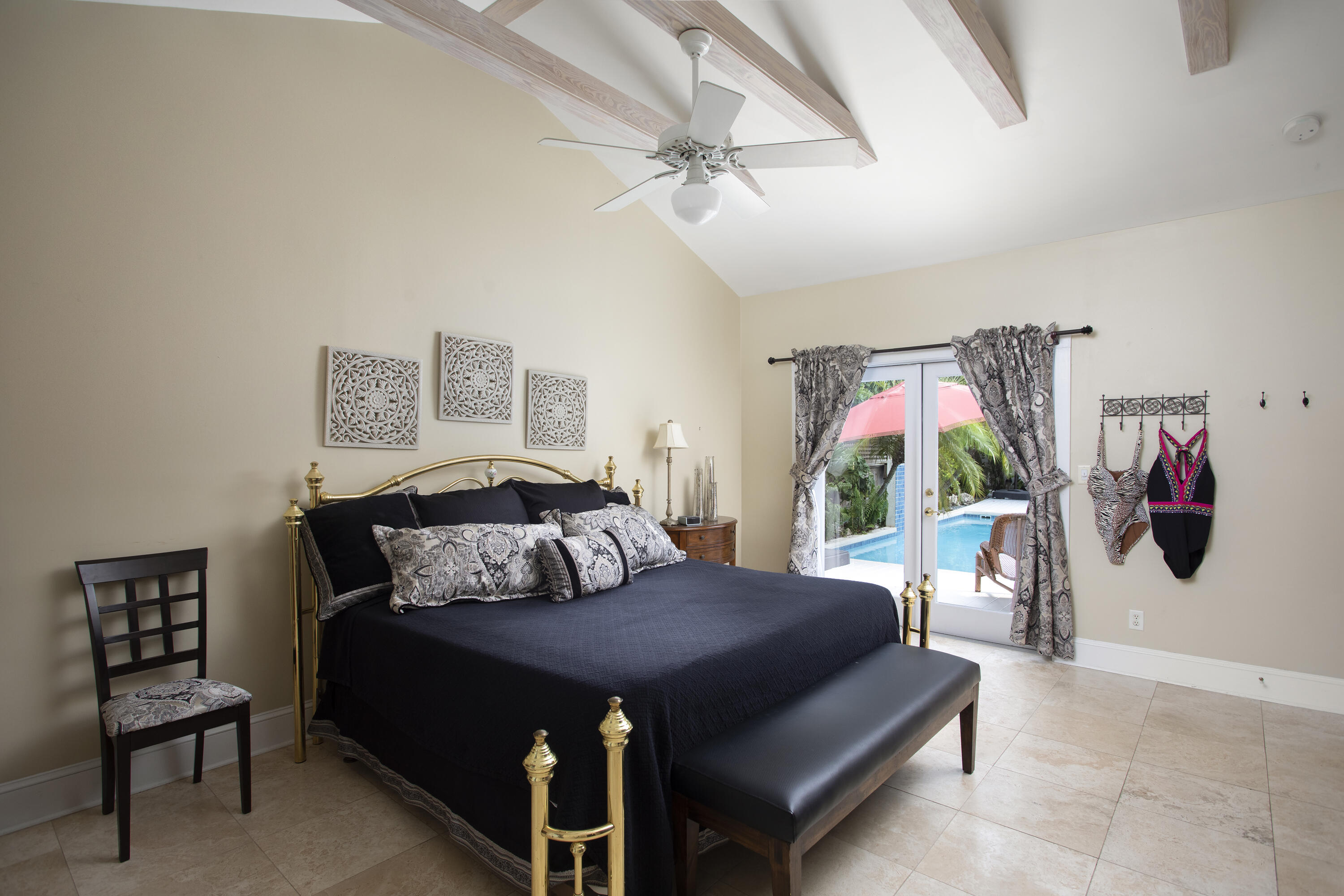 1506 South Street Key West, FL 33040 - Photo 5 of 27 a bedroom with a bed and a chandelier